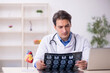 © Elnur - Young male doctor radiologist working at the hospital