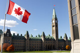 Fototapeta Big Ben - Canadian flag waving in front of the parliament
