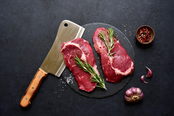 Poster - Raw organic rib eye steak with ingredients for making. Top view with copy space.