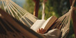Relaxing in the Hammock: Person Reading a Book
