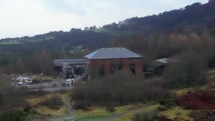 Sticker - Aerial drone footage of a big building in a rural area surrounded by wild nature