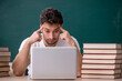 © Elnur - Young male student sitting in the classroom