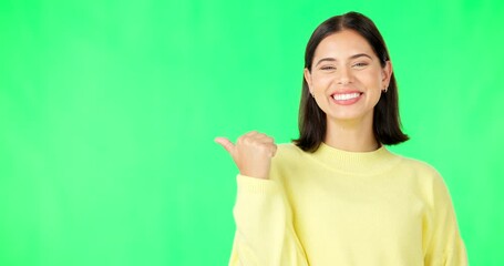 Canvas Print - Portrait, pointing and branding with a woman on green screen space in studio for marketing or product placement. Hand gesture, advertising and options with an attractive young female on chromakey