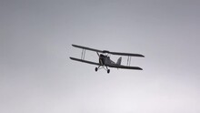 Low-angle Shot Of The Vintage Biplane Flying In The Sky