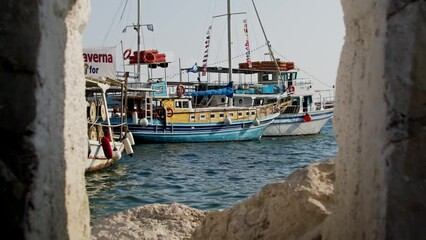 Sticker - Ships on the shore in Parga, Greece under clear cloudless sky