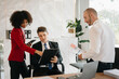 © Nuttapong punna - Office colleagues have a casual discussion. During a meeting in a conference room, a group of business teem sit in the conference room new startup project..