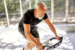 © Flamingo Images - Mature man riding on an exercise bike