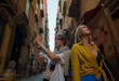 © M-Production - Two female tourists exploring the old town.