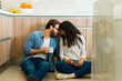 Loving young couple enjoying their coffee in the kitchen