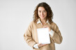 © insta_photos - Young happy woman model student holding digital tablet computer showing blank empty mock up screen display advertising software, website or web service standing isolated on white background.