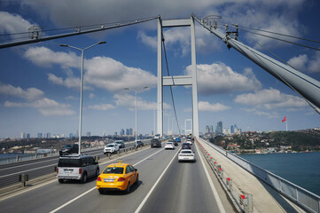 Cars drive on steel bridge in Istanbul