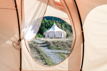 travel.tourist tent camping in the mountains camping tent in the mountains in the summer in the wild