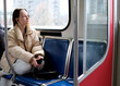 © Oleksandra - young girl teenager rides in transport looks out the window headphone mobile phone peaceful face space for text Sky Train bus car ordinary person in real life street Cities canada suburb surrey