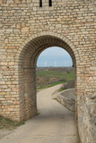 Fototapeta Uliczki - The walls of an ancient fortress on the edge of the rocks on the Black Sea coast. Medieval fortress 