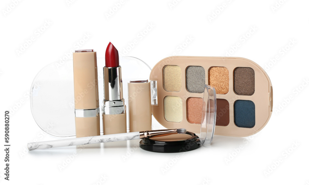 Decorative cosmetics with brush on white background