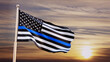 American flag with police blue line on a background of sunset