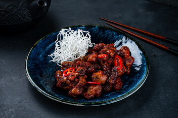 Canvas Print - Fried pork in Thai sweet chili sauce in a plate.