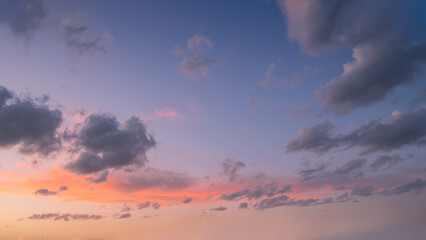 Wall Mural - colorful sky with clouds at beautiful sunset as background.