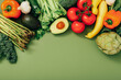 Healthy food background. Different fruits and vegetables on green background.
