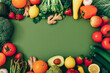 Healthy food background. Different fruits and vegetables on green background.