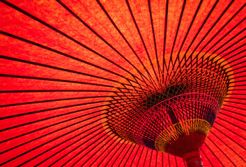 Design details underneath a red Japanese umbrella. In a Japanese restaurant in Auckland.