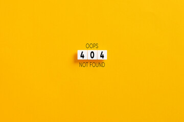 white letter blocks on yellow background with the website error message 404 not found.