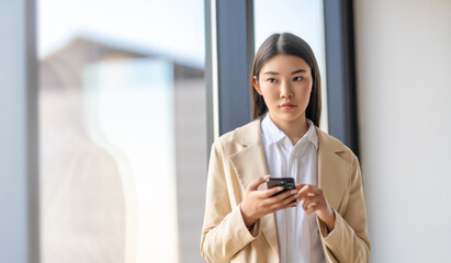 asian woman is using phone