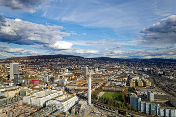Wall Mural - Aerial view of City of Zürich with industrial district on a blue cloudy late winter day. Photo taken March 15th, 2023, Zurich, Switzerland.