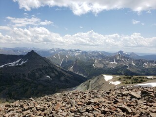 Beautiful view of mountains under a blue sky with clouds.