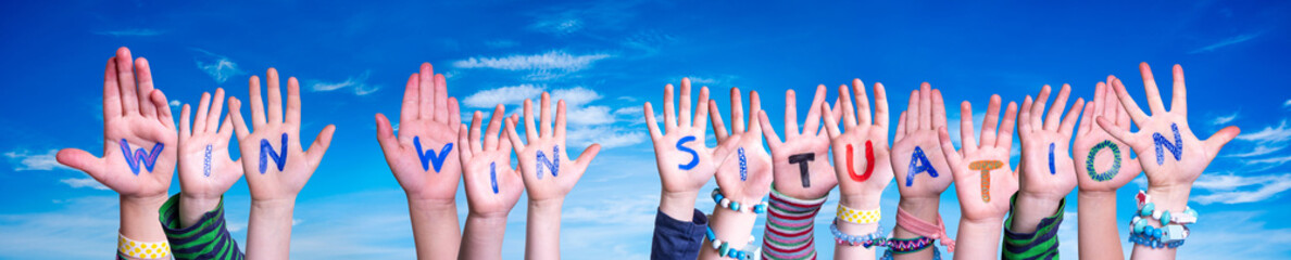 Wall Mural - Children Hands Building Word Win Win Situation. Blue Sky