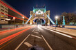 Light trails on a Tower bridge which crosses the river at UK