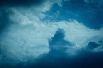 Poster - View of the sky with dark clouds in stormy weather before a thunderstorm, at the sunset