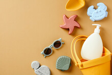 Children's Sand Molds, Sun Lotion, Sunglasses On Sand Color Background