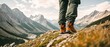 © Budjak Studio - Close-up of the trekking shoes of a hiker crossing a mountainous area at the top of a hill. Generative AI.