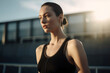 © GVS - Young beautiful woman in sporty black tank top standing outdoors relax. Generative AI