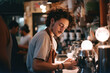 © GVS - Handsome male barista is working in coffee shop, making coffee behind the bar counter. Generative AI