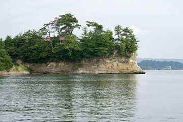 Wall Mural - Rock face of the peninsula seen from Koiji Beach