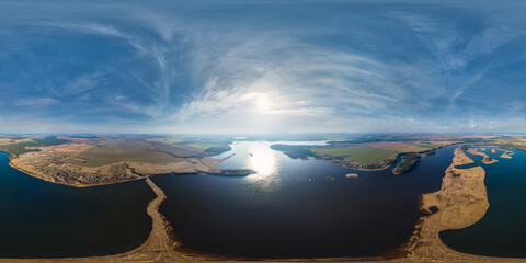 Wall Mural - 360 hdri panorama aerial view over lake with island in equirectangular seamless spherical projection with zenith and nadir,  ready for use as sky replacement in drone 360 panoramas or VR content