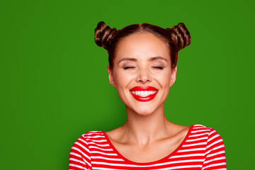 Poster - Close up the girl's face with a wide smile and blinked eyes with happiness isolated on red bright background