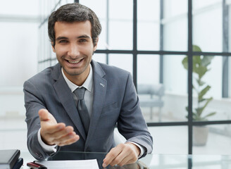 Wall Mural - businessman extends his hand for a hand shake