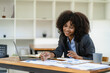 © ArLawKa - Charming young African American businesswoman, stock market trader and research solution for online brokerage. clearing company banking finance