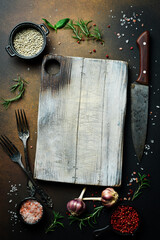 Wall Mural - Empty vintage cutting board on dark wooden planks food background concept.