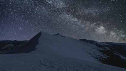 Wall Mural - milky way galaxy stars sky over winter alps mountains astronomy time lapse background
