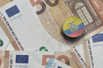 euro coin with national flag of ecuador on the euro money banknotes background