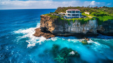 A Stunning Image Of A Lavish Villa Perched Atop A Coastal Cliff, Providing The Ultimate Secluded And Indulgent Retreat
