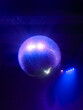 disco ball illuminated by blue light in a night club