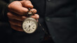 © francescosgura - Man holds pocket watch in hand