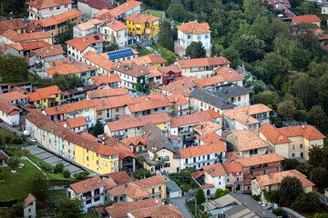 A bird's eye view of a village houses with a red roofs