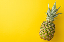 Top Close Up View Photo Of One Single Pineapple Isolated On Vivid Yellow Backdrop With Empty Space For Text