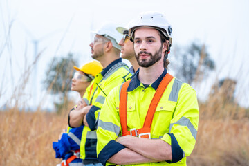 Wall Mural - Maintenance engineer man working in wind turbine farm,Wind turbine operations that transform wind energy into electrical electricity,Clean energy concept saves the world.